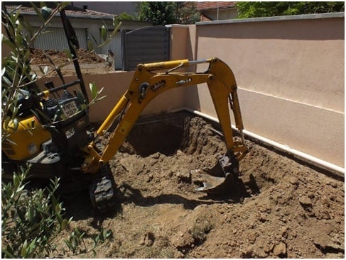 Excavating to sink the cedar tub below the deck